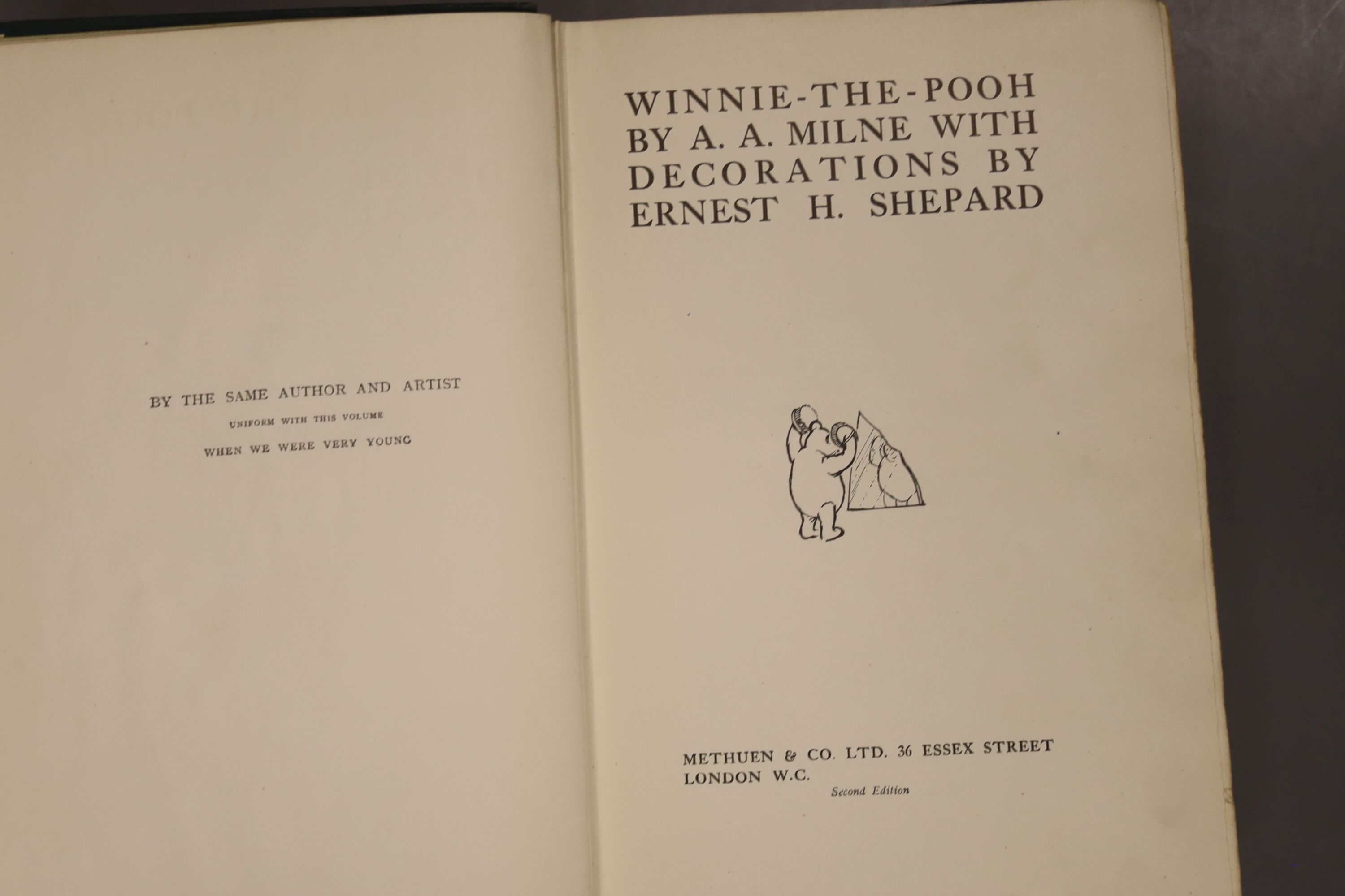 Milne, A.A – Winnie The Pooh, second edition, 8vo, cloth bound, (dj missing, inscribed, scuffs to covers, internal break to the spine) Methuen, London 1926., Milne, A.A – The House At Pooh Corner, first Canadian edition,